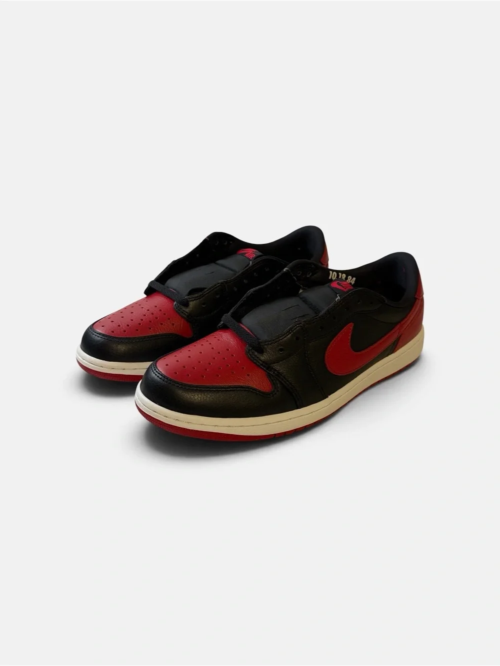 Jordan Low Top Sneaker in Black and Red